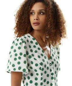 Liquorish Green Polka Dot Jumpsuit in White -Liquorish Sales Store 7c265c7f5d6d4304a6765b3a3640659e scaled